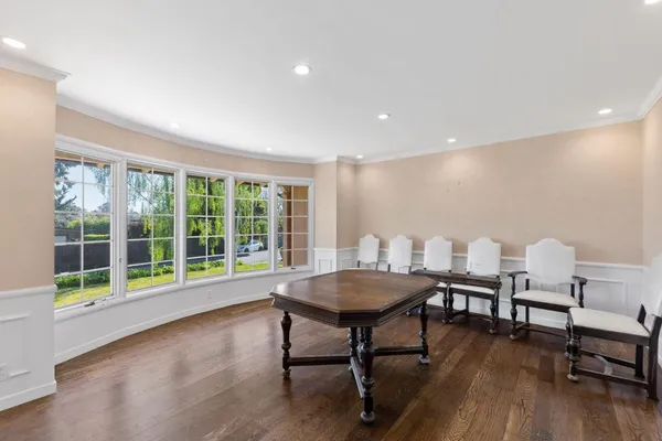 a kitchen with stainless steel appliances granite countertop a stove a refrigerator and a wooden cabinets