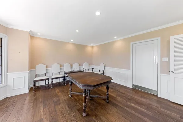 a view of kitchen with wooden floor and electronic appliances