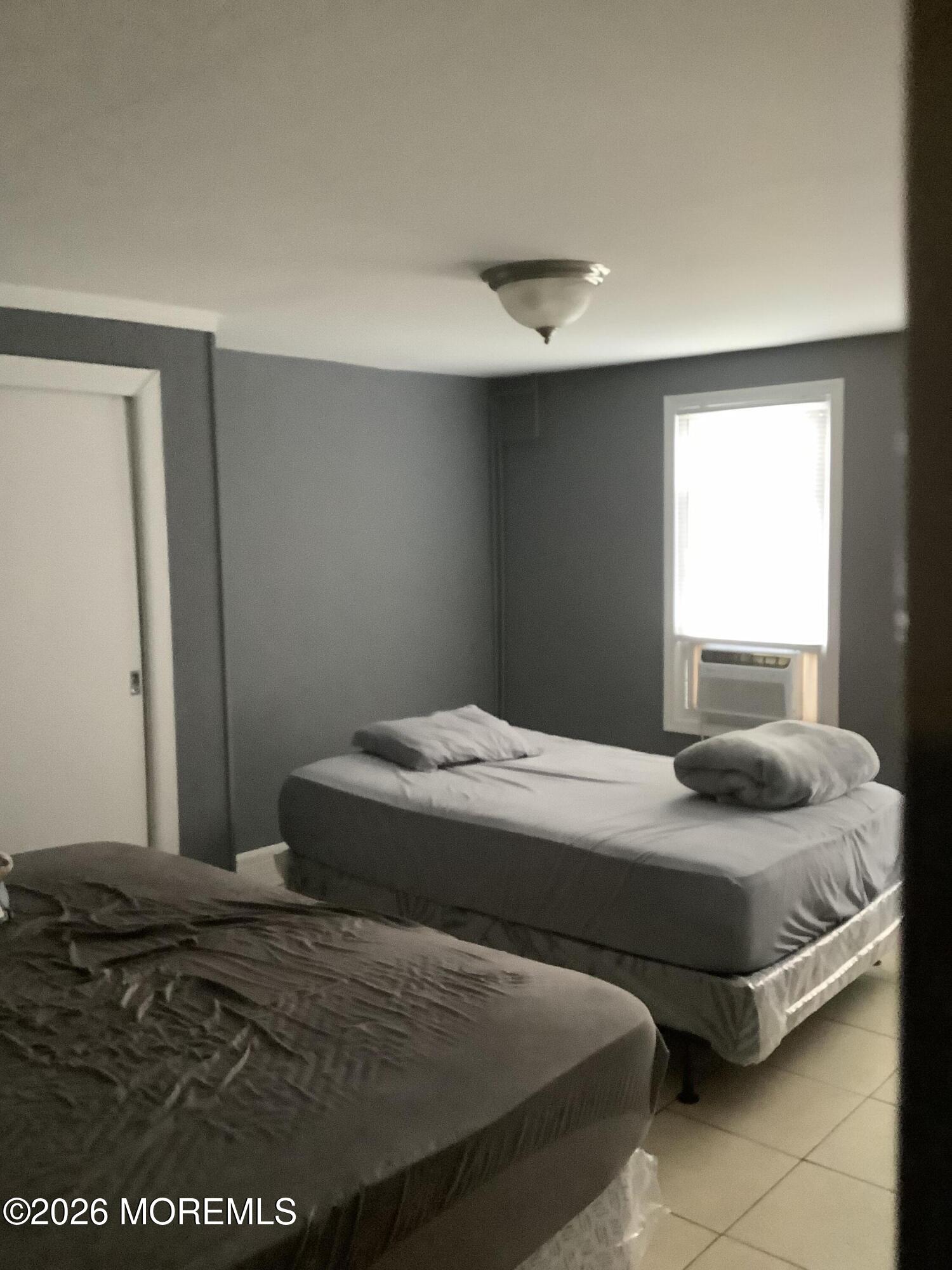 242 1st Street Keyport, NJ 07735 - Photo 20 of 23 a bedroom with a bed and a window