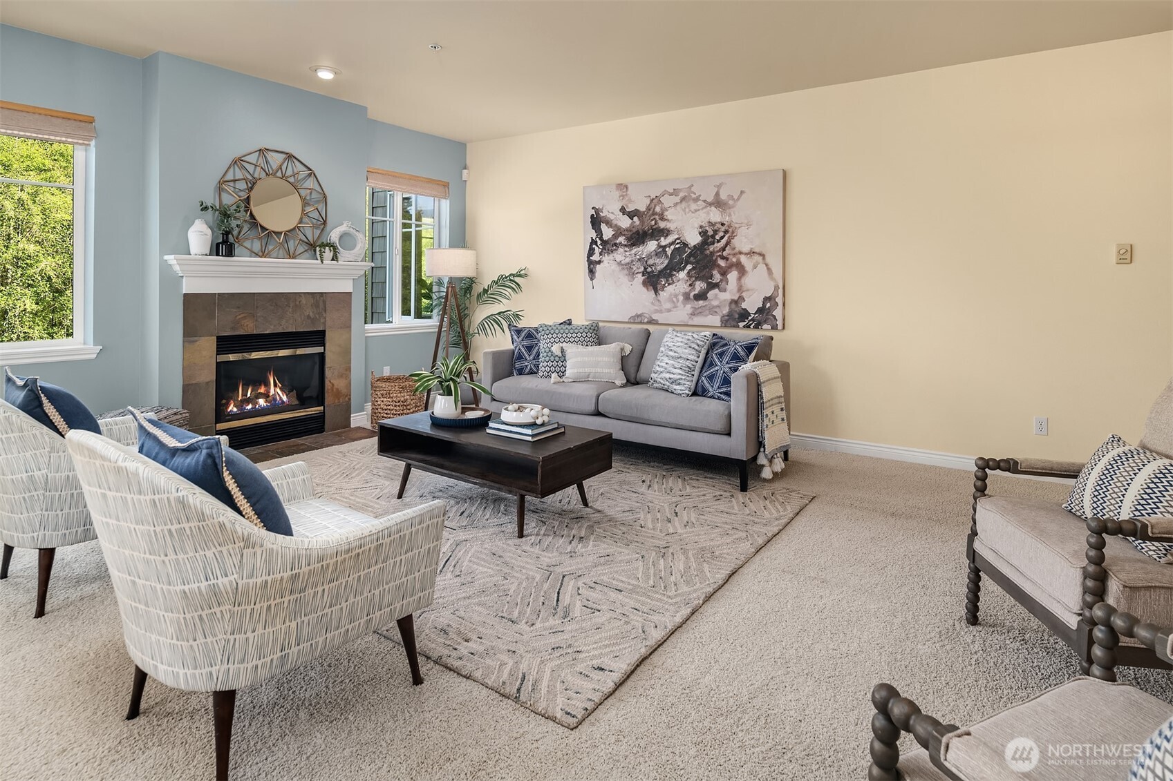 17432 Bothell Way Northeast, Unit B305 Bothell, WA 98011 - Photo 18 of 39 a living room with furniture and a fireplace