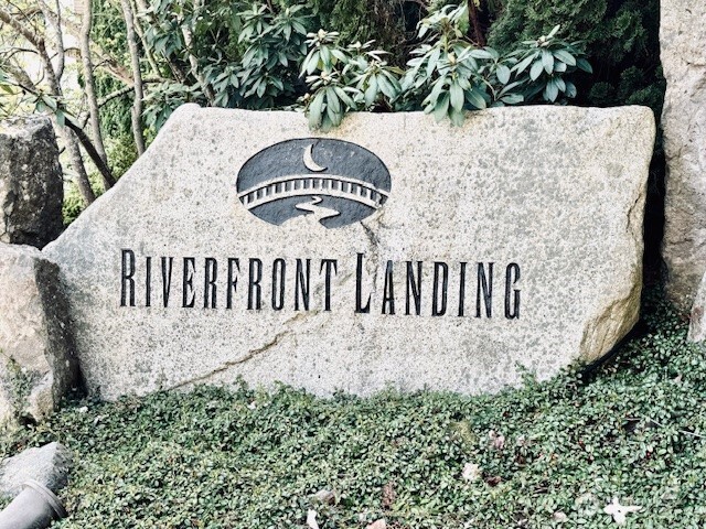 17432 Bothell Way Northeast, Unit B305 Bothell, WA 98011 - Photo 3 of 39 a view of a sign in a yard with potted plants