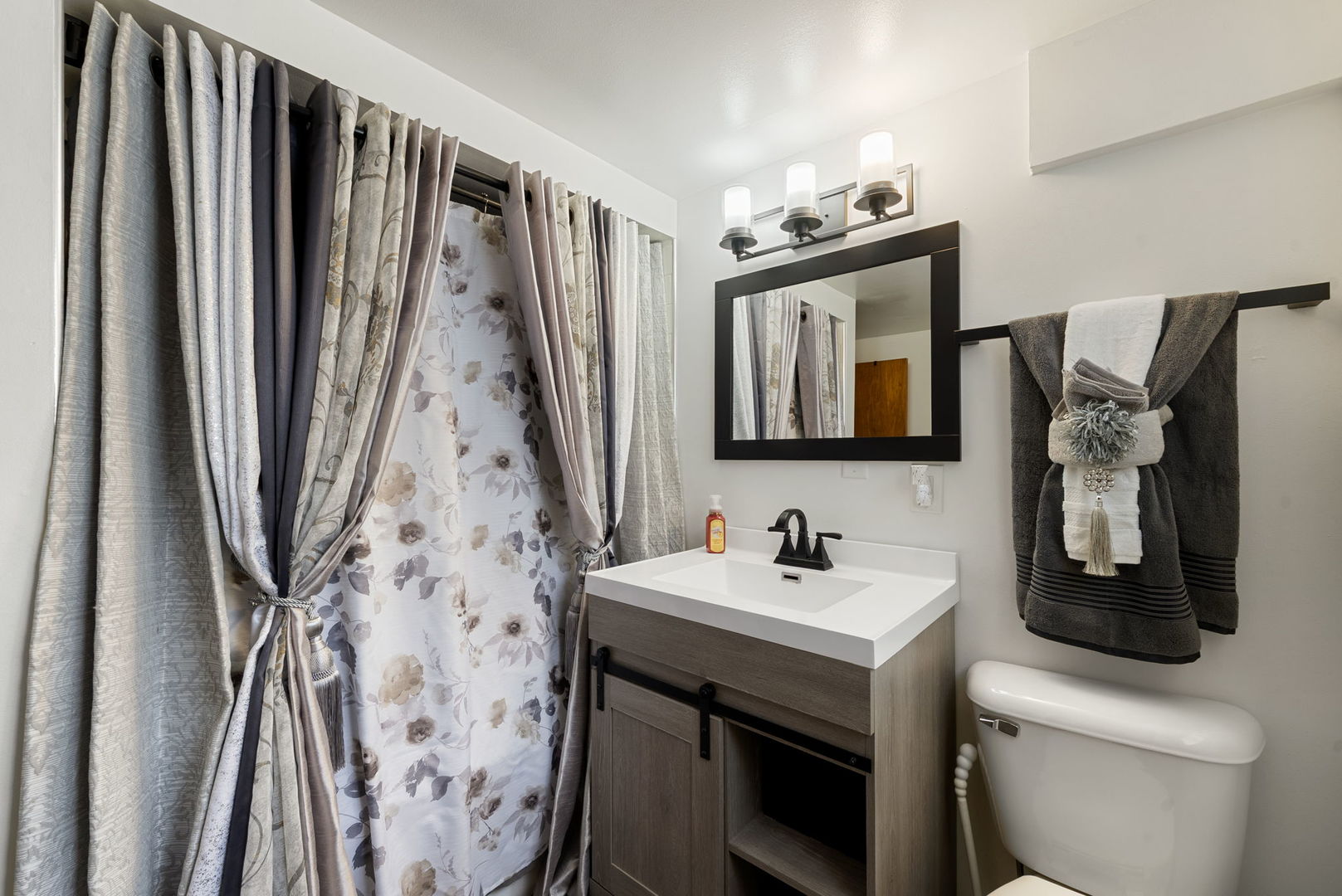 4613 Madison Avenue Brookfield, IL 60513 - Photo 20 of 33 a bathroom with a sink and mirror with toilet