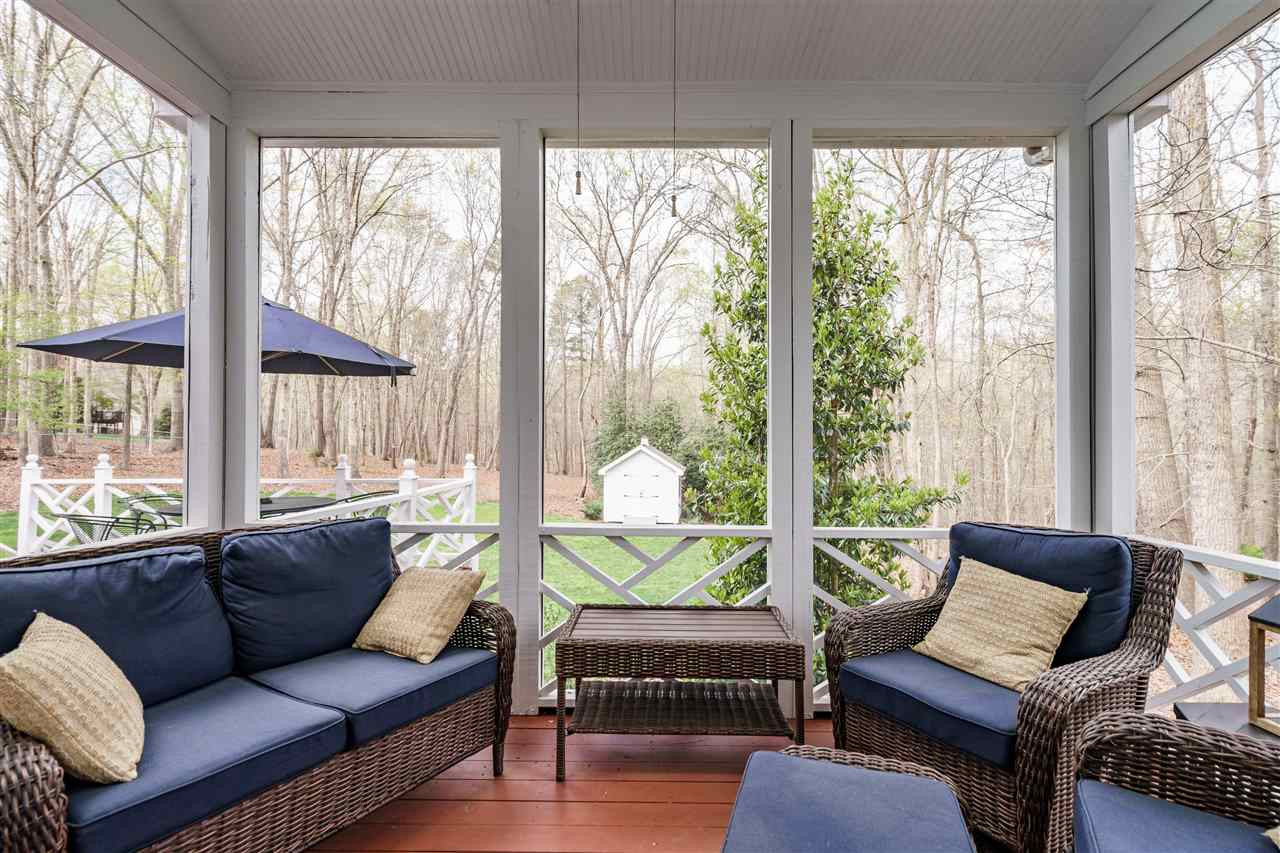 10709 Dunhill Terrace Raleigh, NC 27615 - Photo 27 of 30 This beautiful screen porch only shows a small portion of the beautiful panoramic view. Peace and serenity aren't hard to find here. Screen Porch