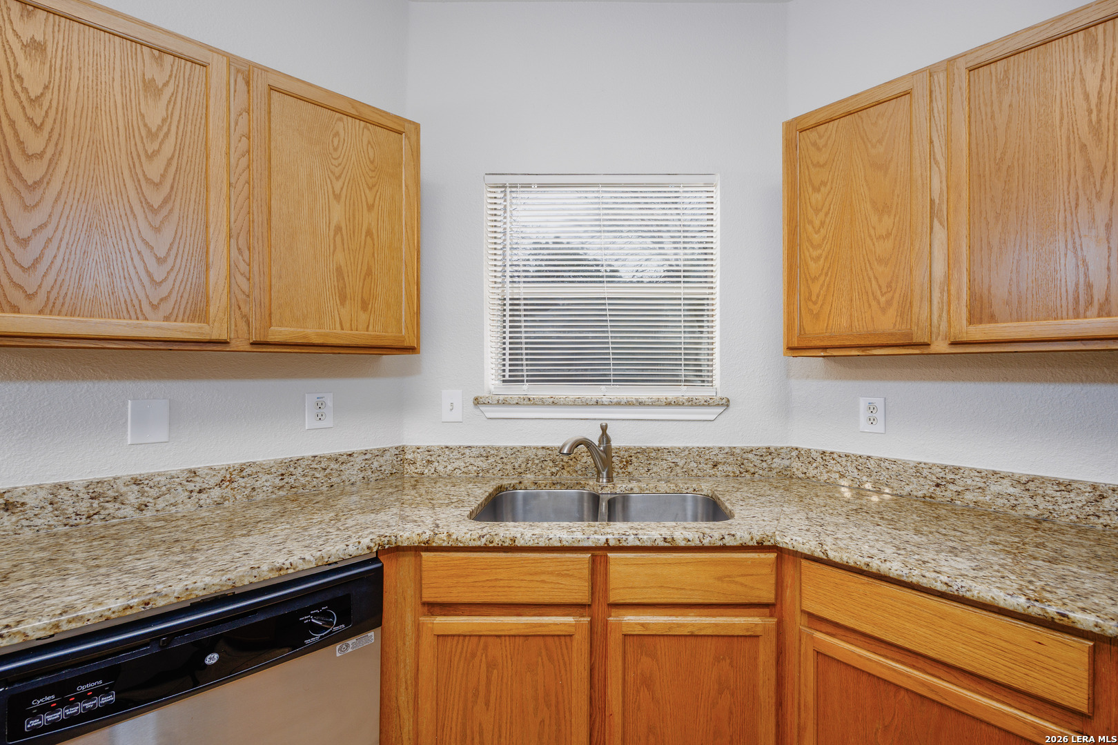 12 Lockspring San Antonio, TX 78254 - Photo 11 of 35 a kitchen with granite countertop cabinets sink and window