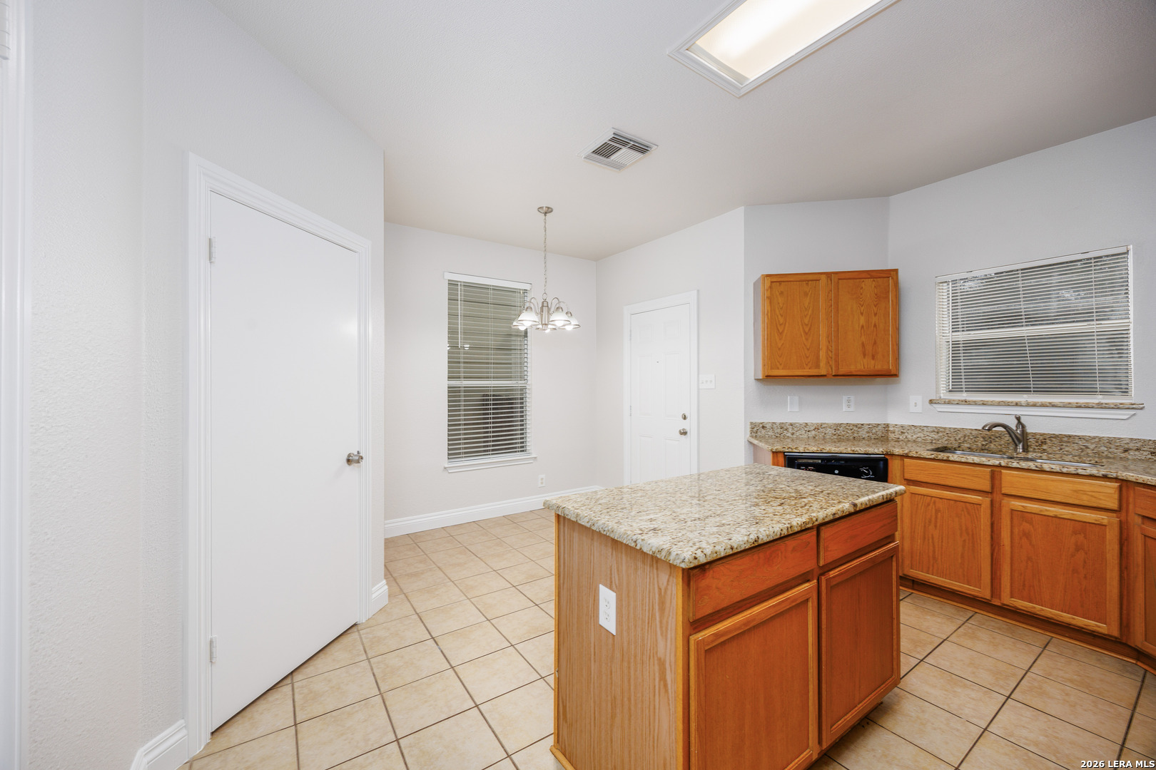 12 Lockspring San Antonio, TX 78254 - Photo 12 of 35 a kitchen with granite countertop a sink stove and cabinets
