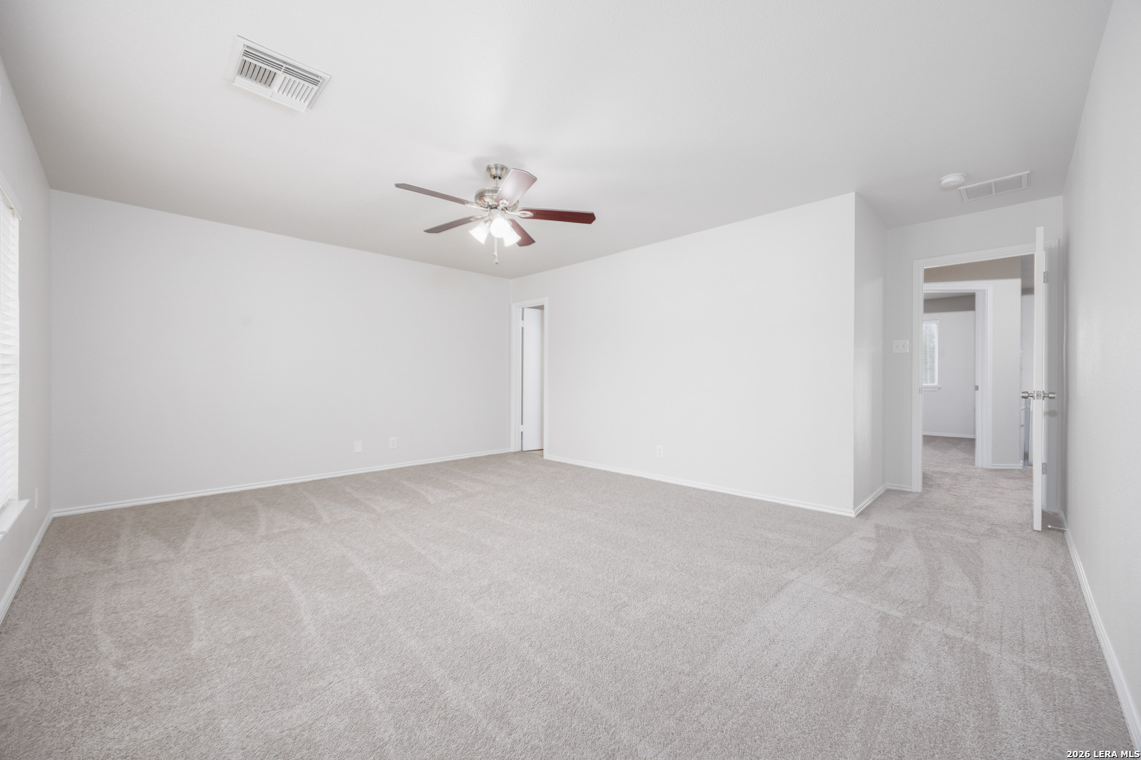 12 Lockspring San Antonio, TX 78254 - Photo 24 of 35 a view of an empty room with a chandelier fan
