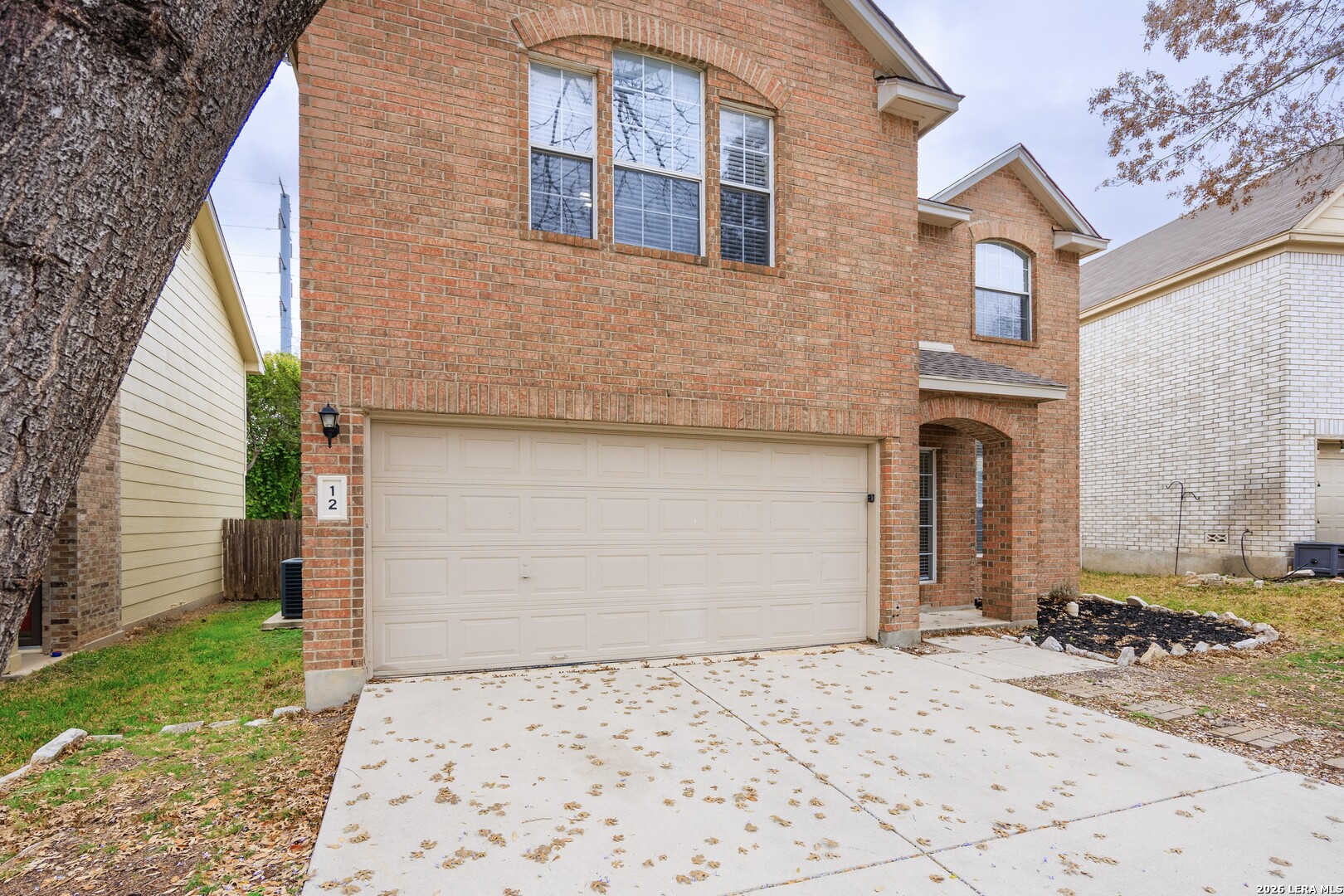 12 Lockspring San Antonio, TX 78254 - Photo 3 of 35 a front view of a house with garden