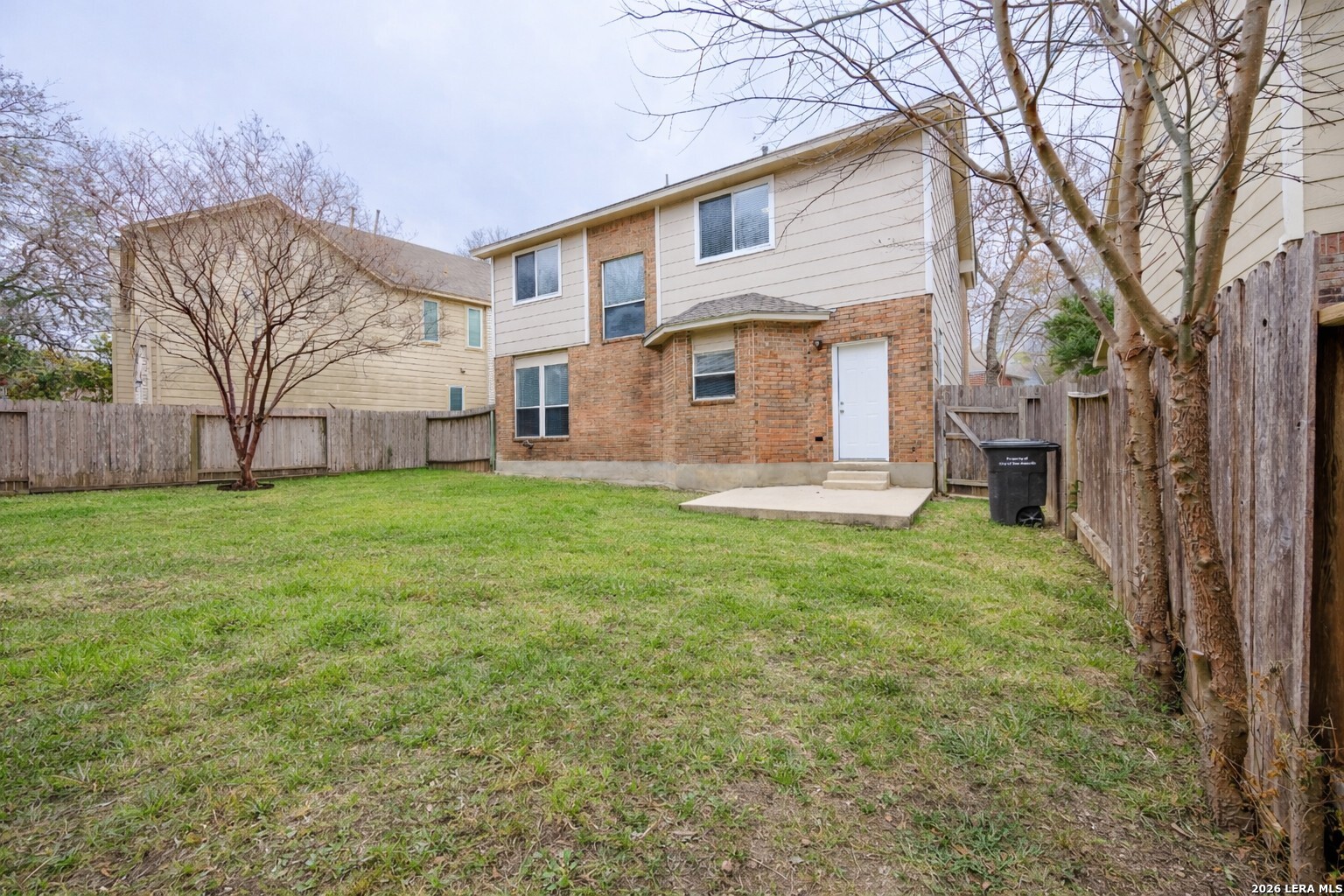 12 Lockspring San Antonio, TX 78254 - Photo 32 of 35 a front view of a house with a yard and garage