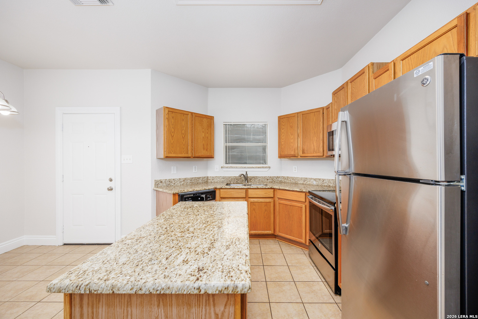 12 Lockspring San Antonio, TX 78254 - Photo 8 of 35 a kitchen with stainless steel appliances granite countertop a refrigerator sink and stove
