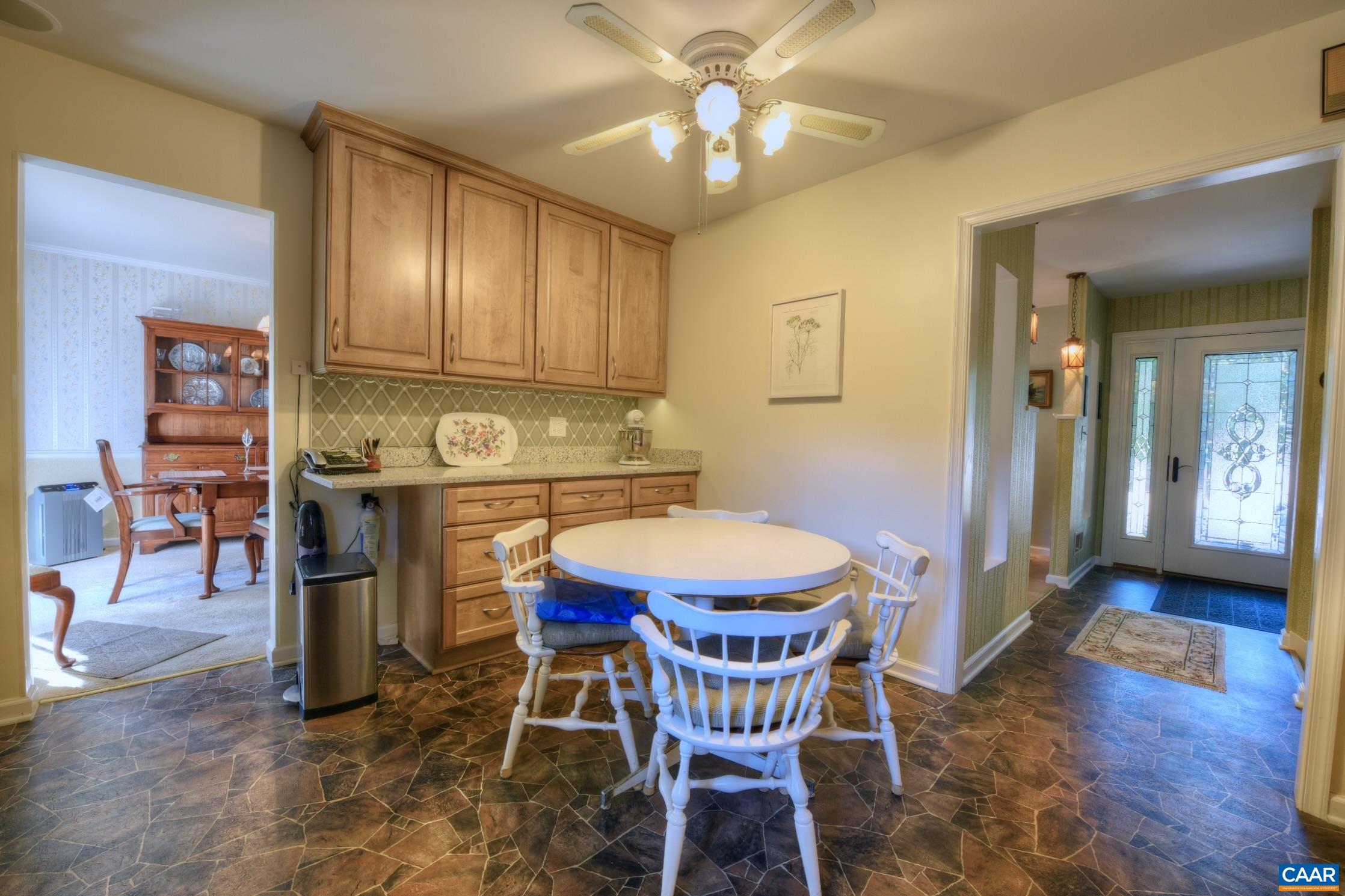 727 Village Road Charlottesville, VA 22903 - Photo 12 of 34 a view of a dining room with furniture and wooden floor