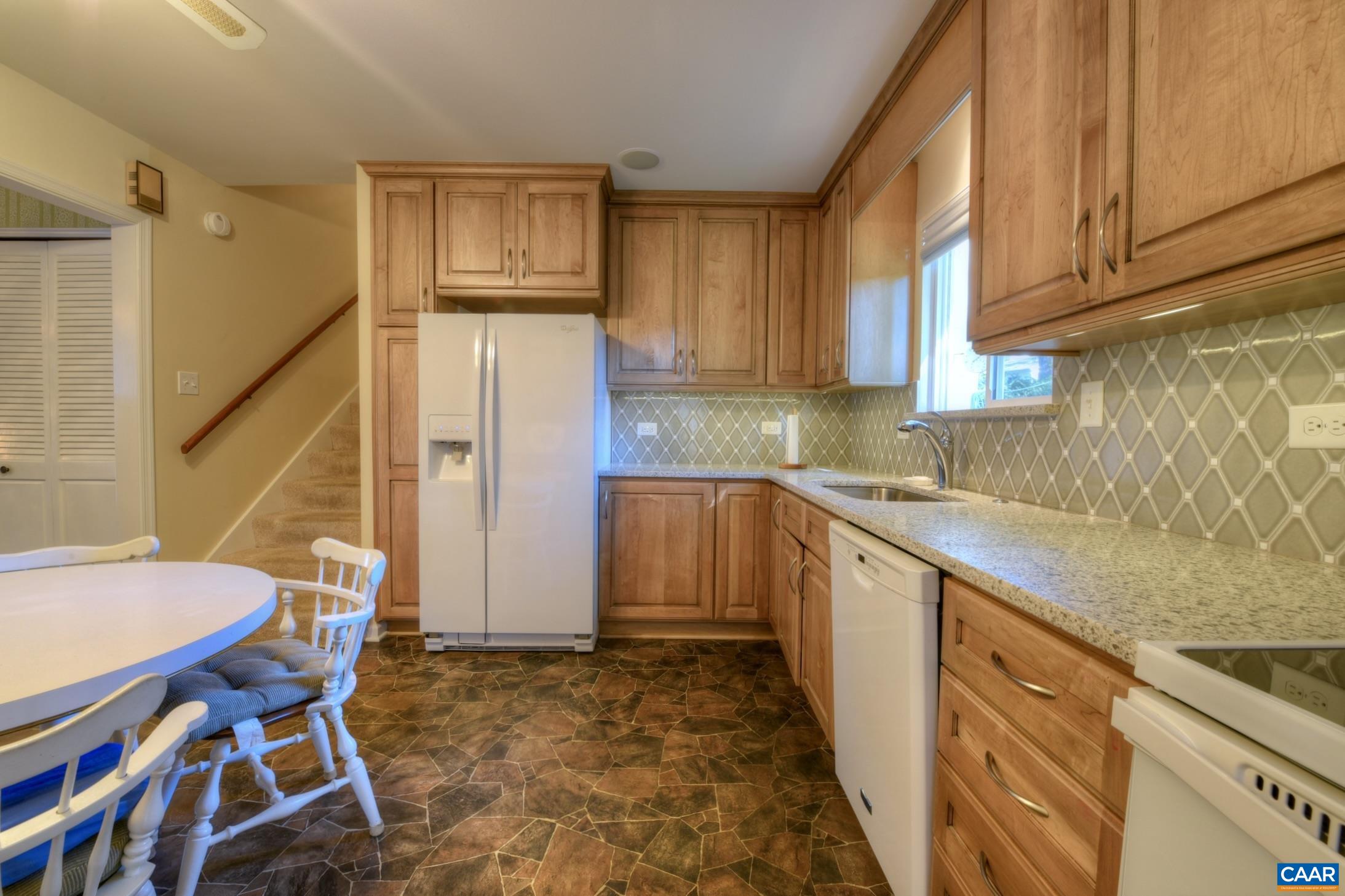 727 Village Road Charlottesville, VA 22903 - Photo 15 of 34 a kitchen with stainless steel appliances granite countertop a sink and cabinets