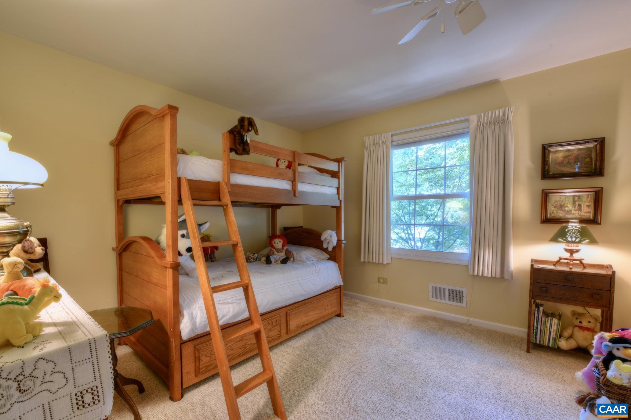 727 Village Road Charlottesville, VA 22903 - Photo 17 of 34 a bedroom with a bed and a tv