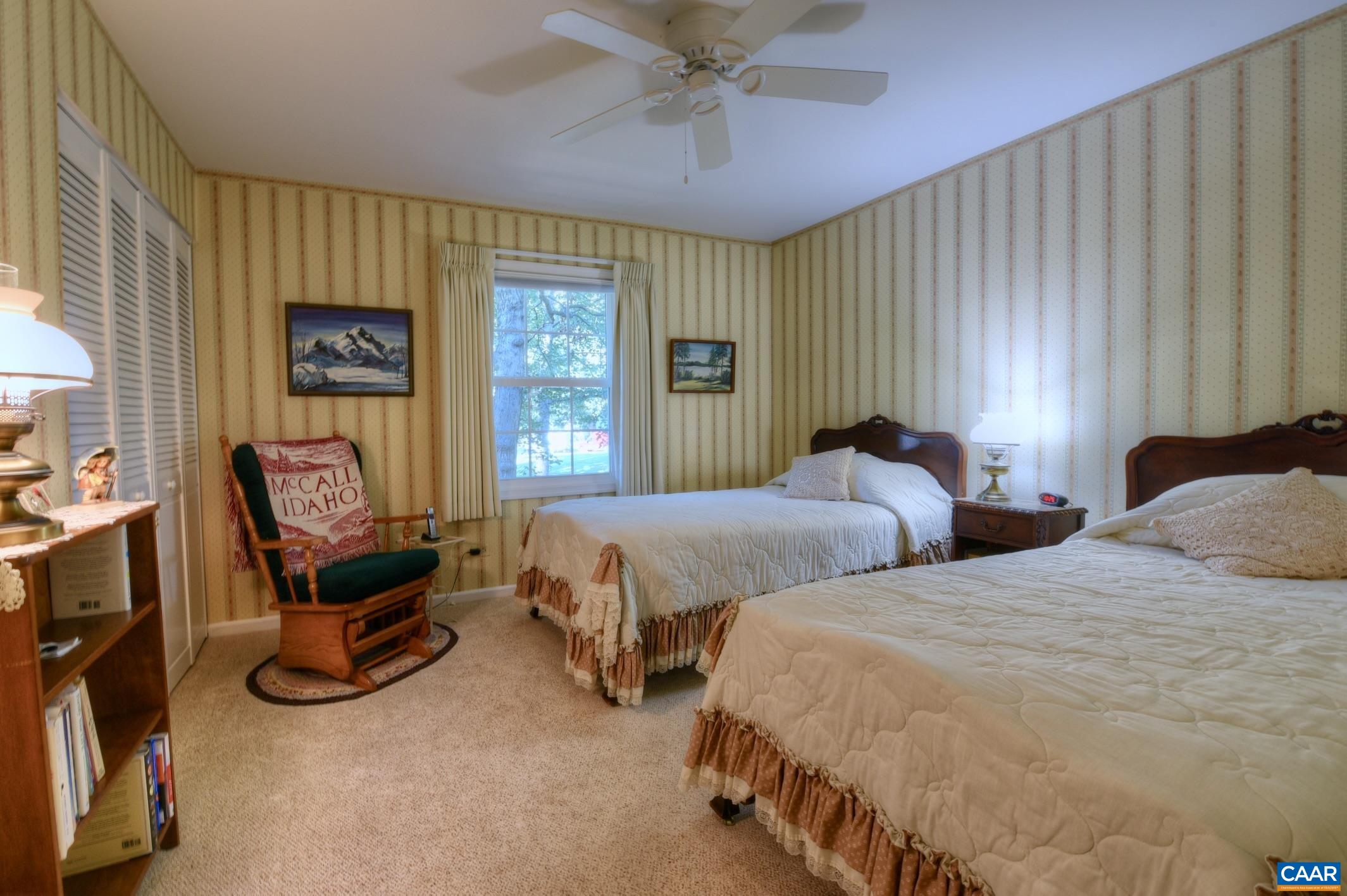 727 Village Road Charlottesville, VA 22903 - Photo 18 of 34 a bedroom with two beds and a window