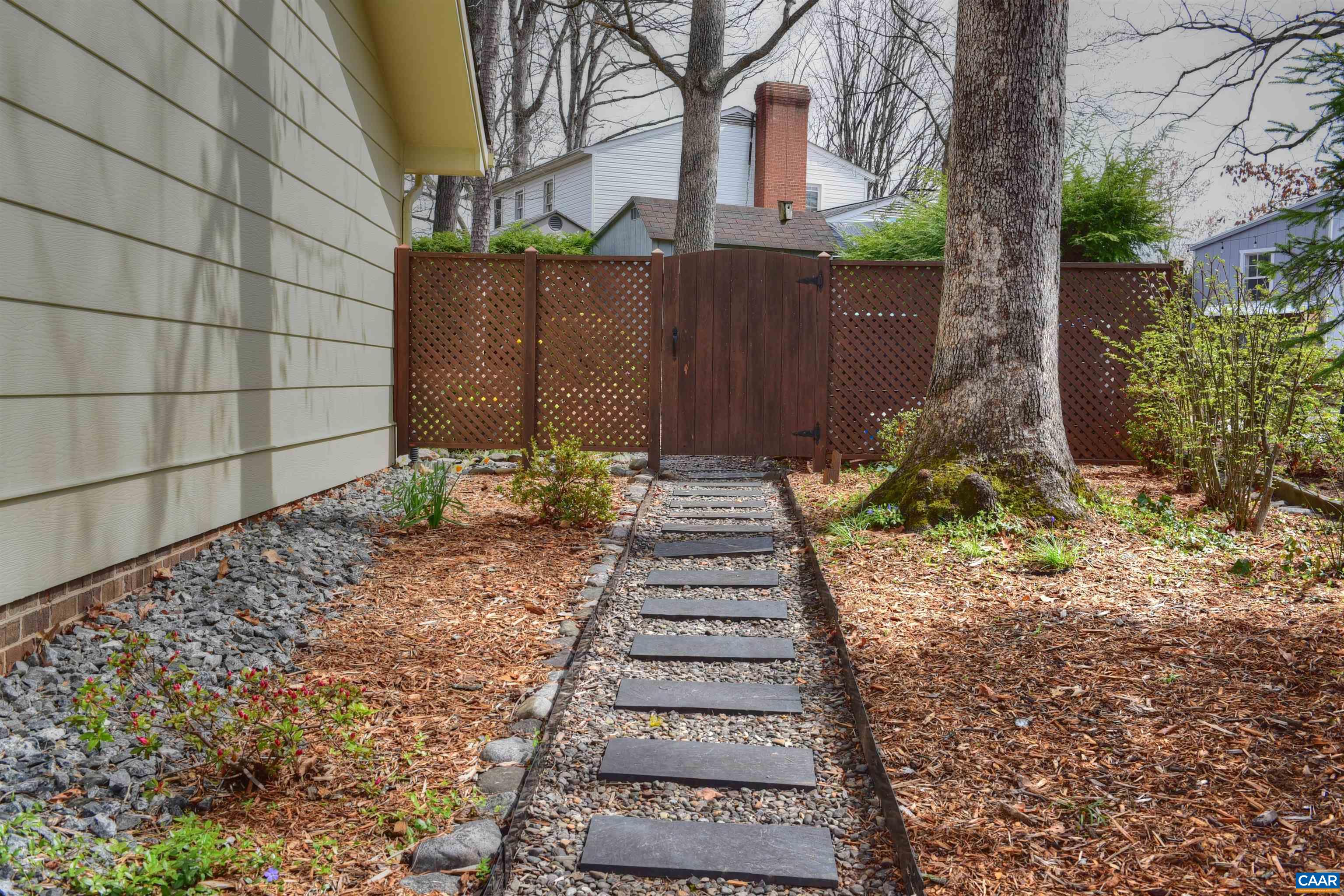 727 Village Road Charlottesville, VA 22903 - Photo 30 of 34 a view of a pathway of house with wooden fence