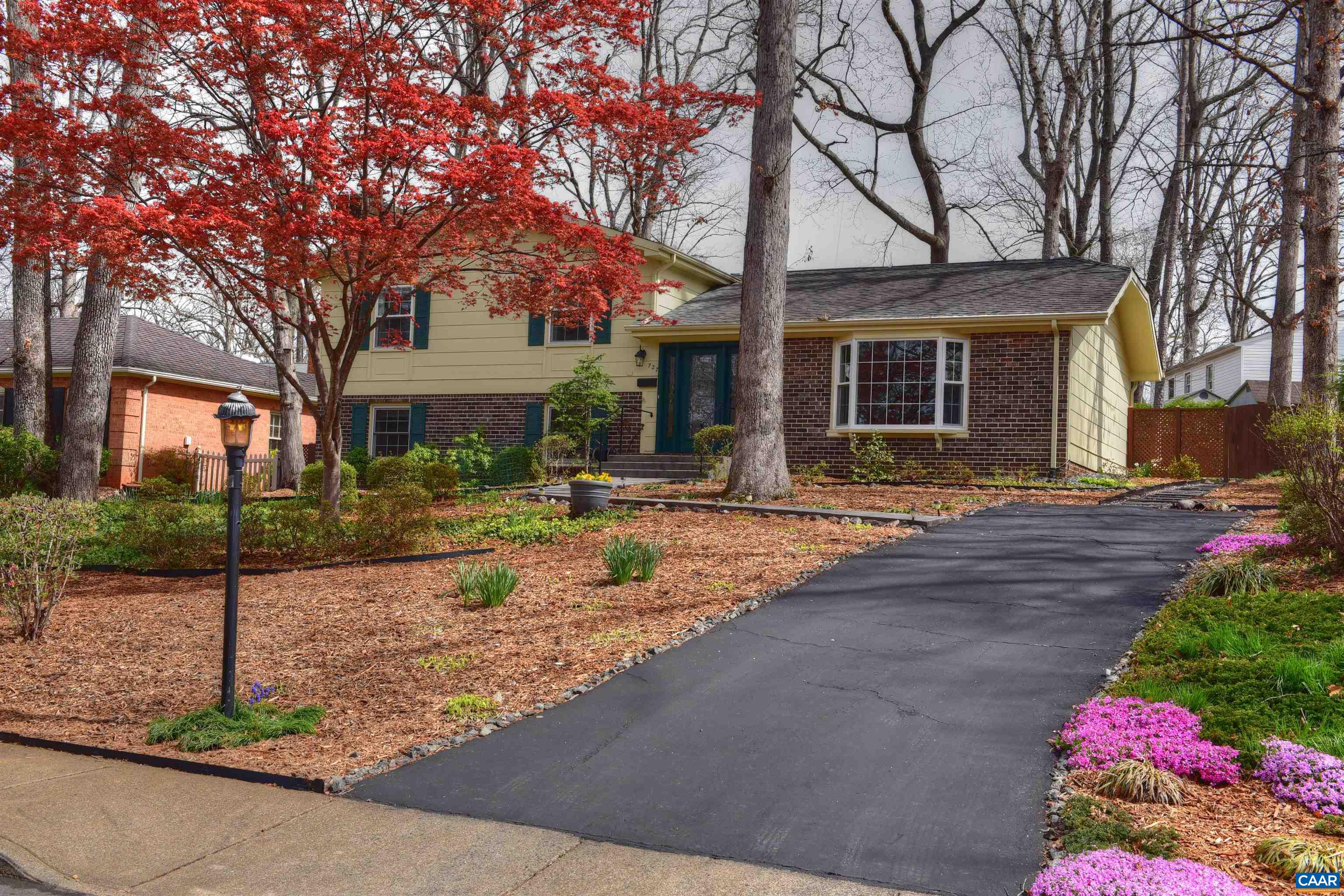 727 Village Road Charlottesville, VA 22903 - Photo 34 of 34 a front view of a house with yard and tree s