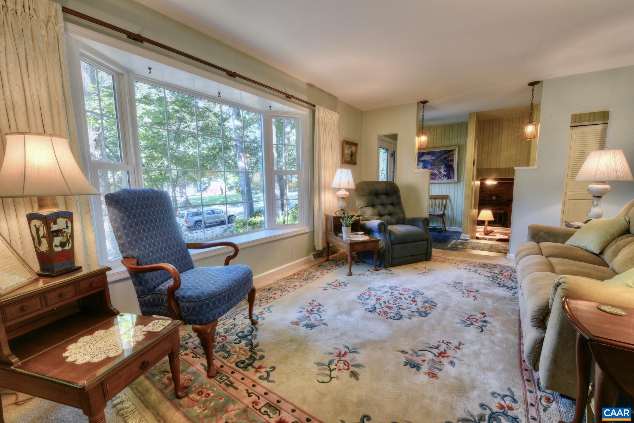 727 Village Road Charlottesville, VA 22903 - Photo 7 of 34 a living room with furniture and a large window