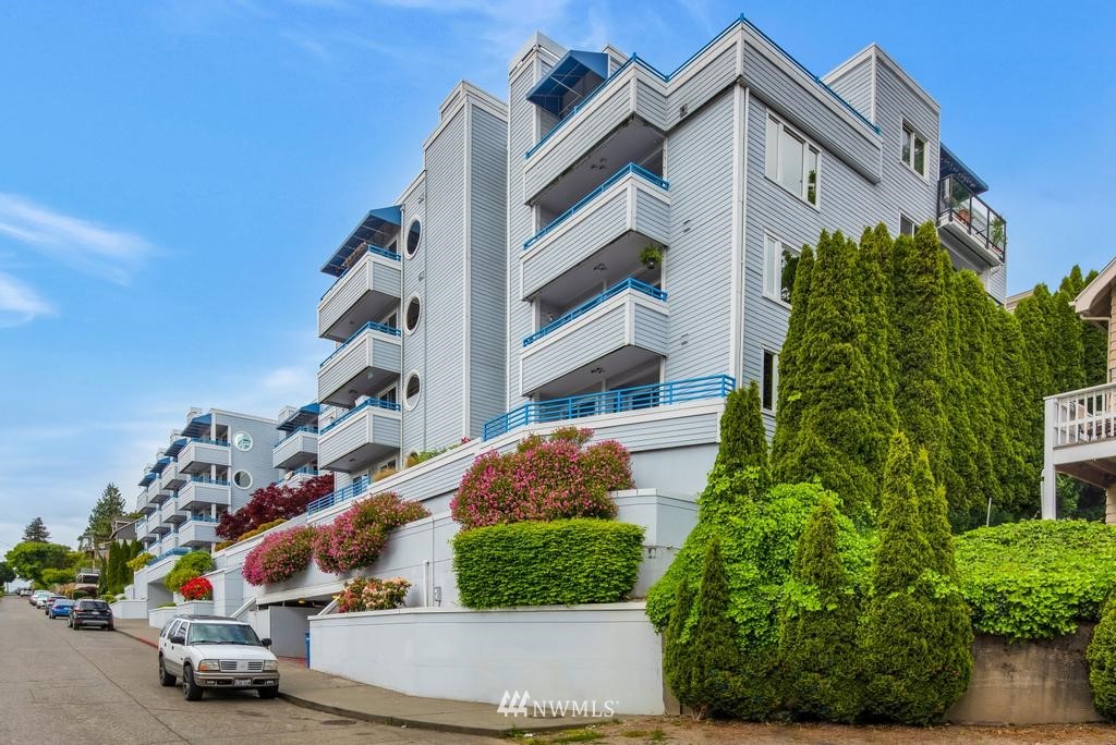 2244 13th Avenue West, Unit 115 Seattle, WA 98119 - Photo 2 of 19 front view of a house with a street