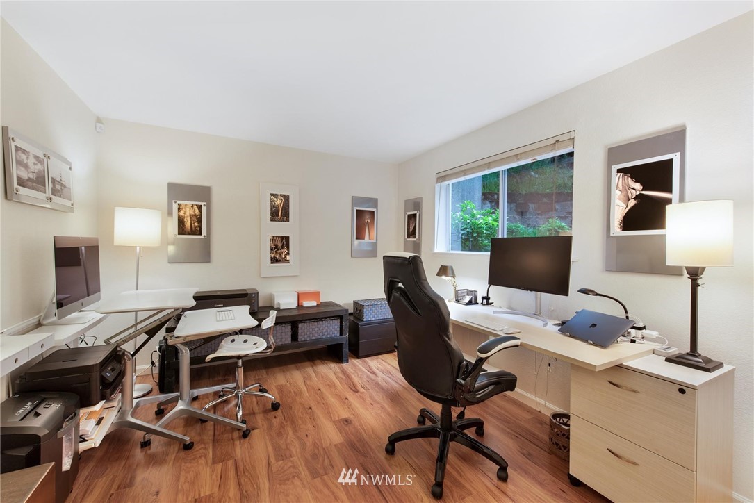 2244 13th Avenue West, Unit 115 Seattle, WA 98119 - Photo 13 of 19 a view of a workspace with furniture and a window