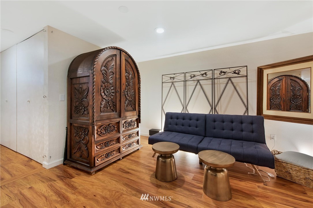 2244 13th Avenue West, Unit 115 Seattle, WA 98119 - Photo 17 of 19 a living room with furniture and a wooden floor