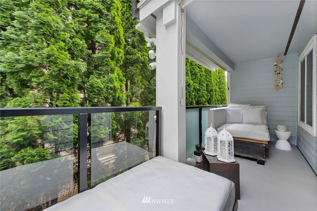 2244 13th Avenue West, Unit 115 Seattle, WA 98119 - Photo 18 of 19 a bedroom with furniture and a large window