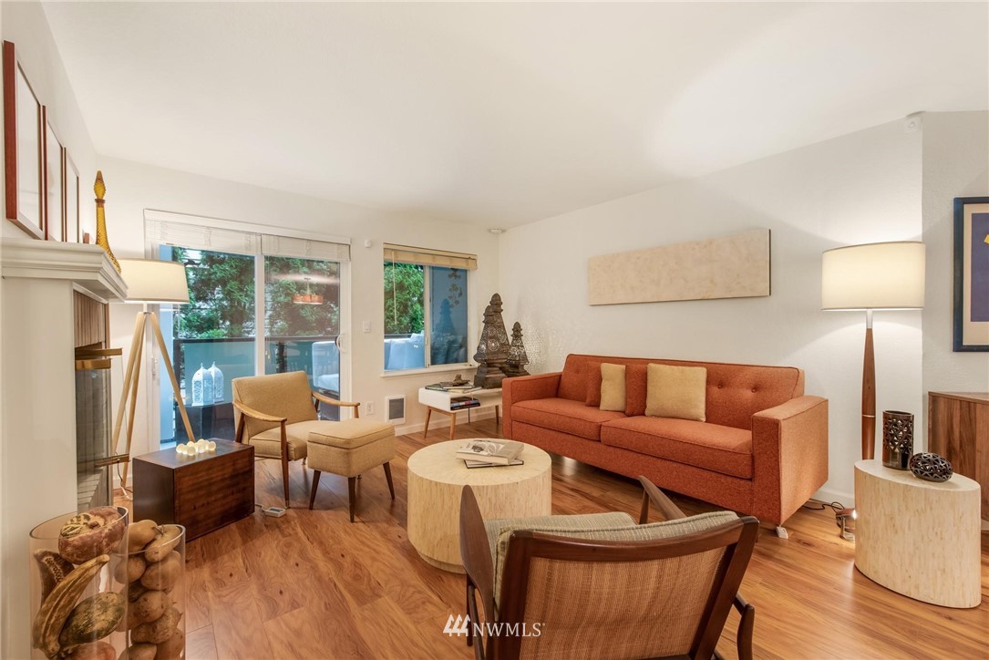2244 13th Avenue West, Unit 115 Seattle, WA 98119 - Photo 6 of 19 a living room with furniture and a large window
