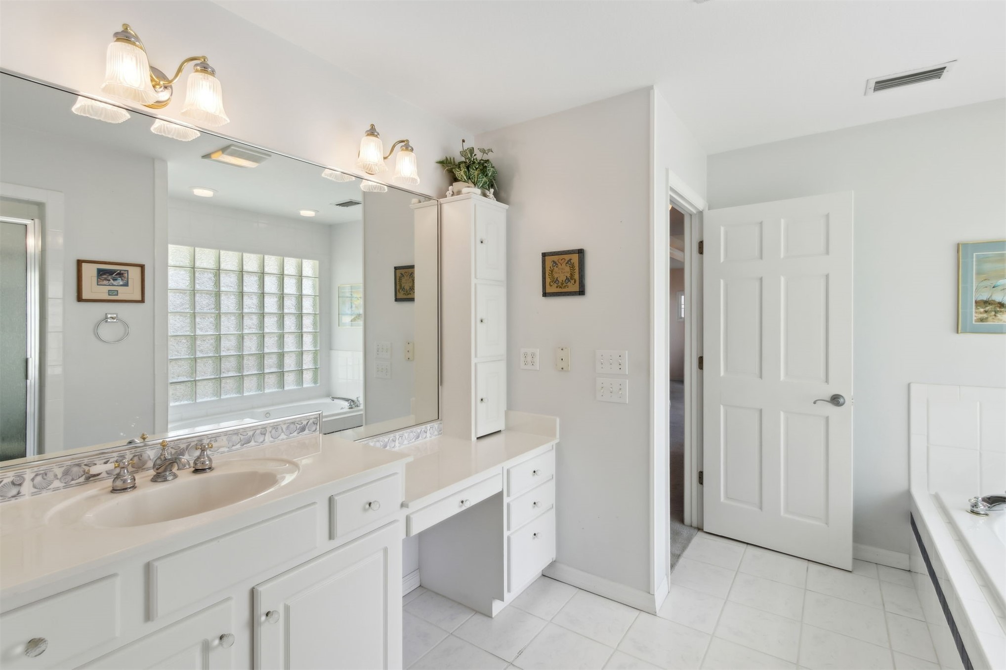 4333 Seminole Street Starke, FL 32091 - Photo 15 of 33 a spacious bathroom with a double vanity sink mirror and double