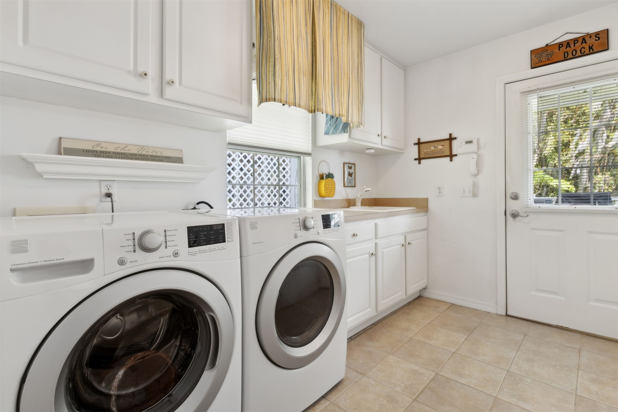 4333 Seminole Street Starke, FL 32091 - Photo 20 of 33 a utility room with sink dryer and washer