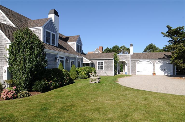 28 Point Road Marion, MA 02738 - Photo 4 of 11 a front view of a house with a yard