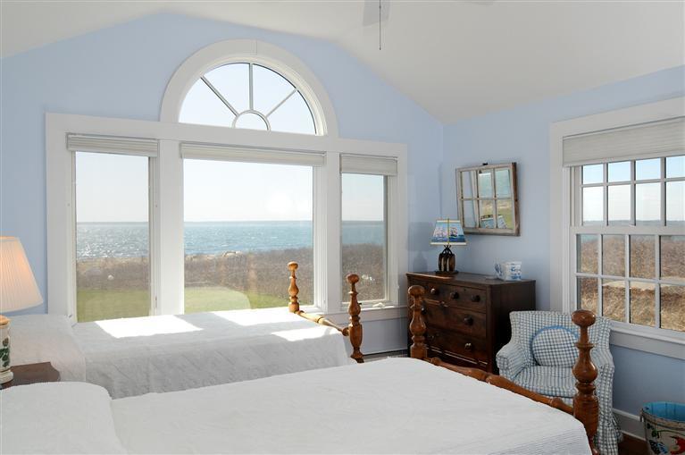 28 Point Road Marion, MA 02738 - Photo 8 of 11 a bedroom with a bed and a large window