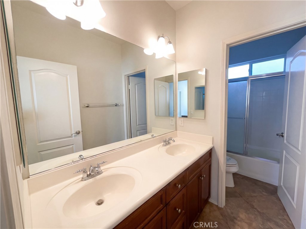 28745 Edenton Way Temecula, CA 92591 - Photo 14 of 23 a bathroom with a sink double vanity and a mirror