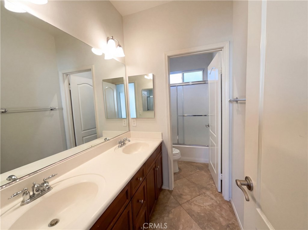 28745 Edenton Way Temecula, CA 92591 - Photo 15 of 23 a spacious bathroom with a double vanity sink mirror and double