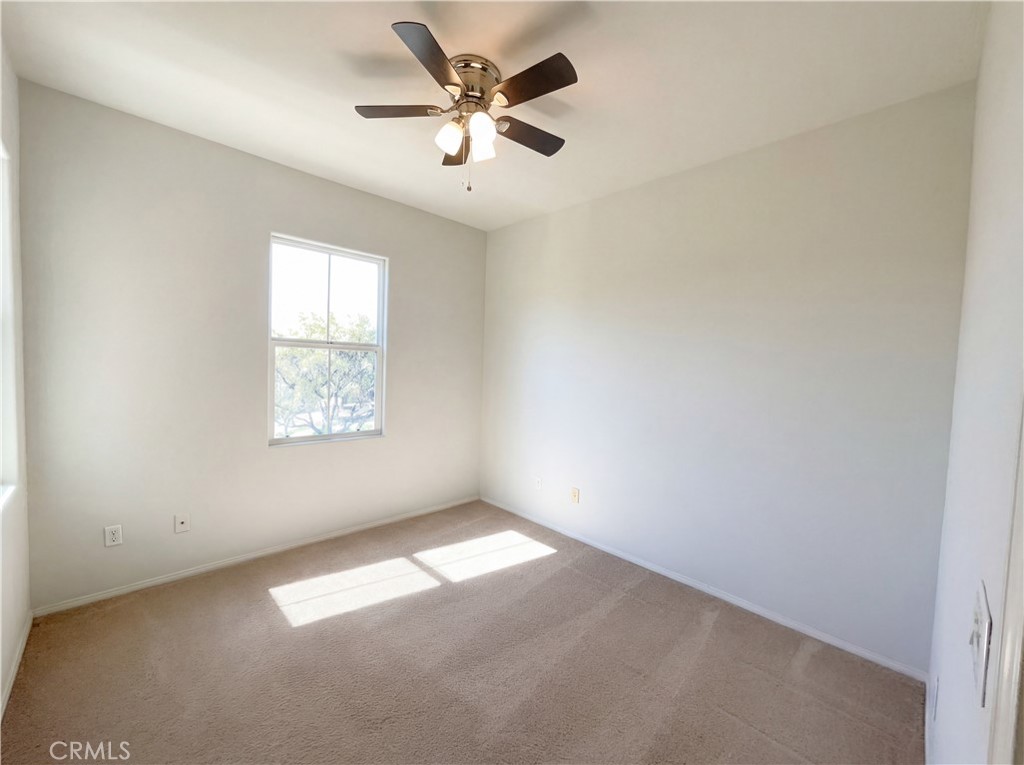 28745 Edenton Way Temecula, CA 92591 - Photo 17 of 23 an empty room with a window and a fan