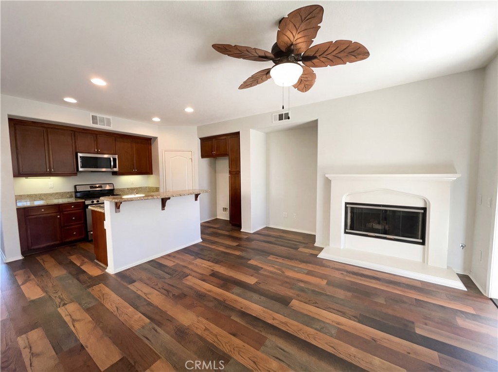 28745 Edenton Way Temecula, CA 92591 - Photo 20 of 23 a kitchen with a refrigerator and a stove top oven