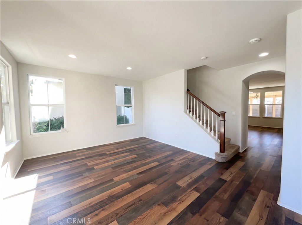 28745 Edenton Way Temecula, CA 92591 - Photo 3 of 23 an empty room with wooden floor and windows