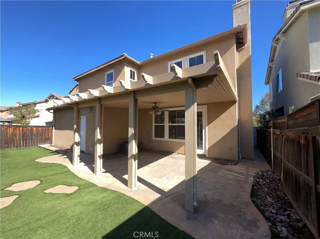 28745 Edenton Way Temecula, CA 92591 - Photo 5 of 23 a front view of a house with a yard