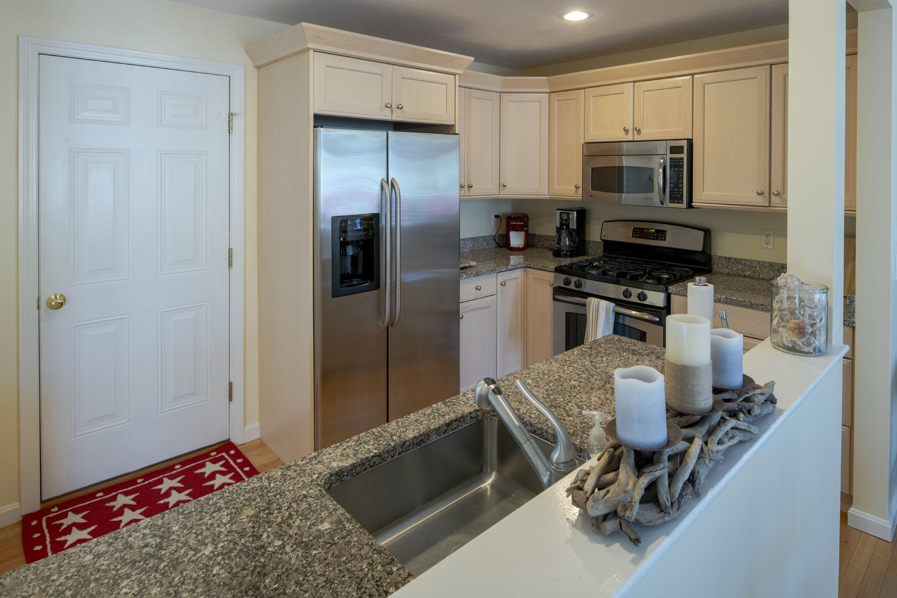 19 NW Landing Mashpee, MA 02649 - Photo 6 of 33 a kitchen with stainless steel appliances granite countertop a refrigerator stove and microwave