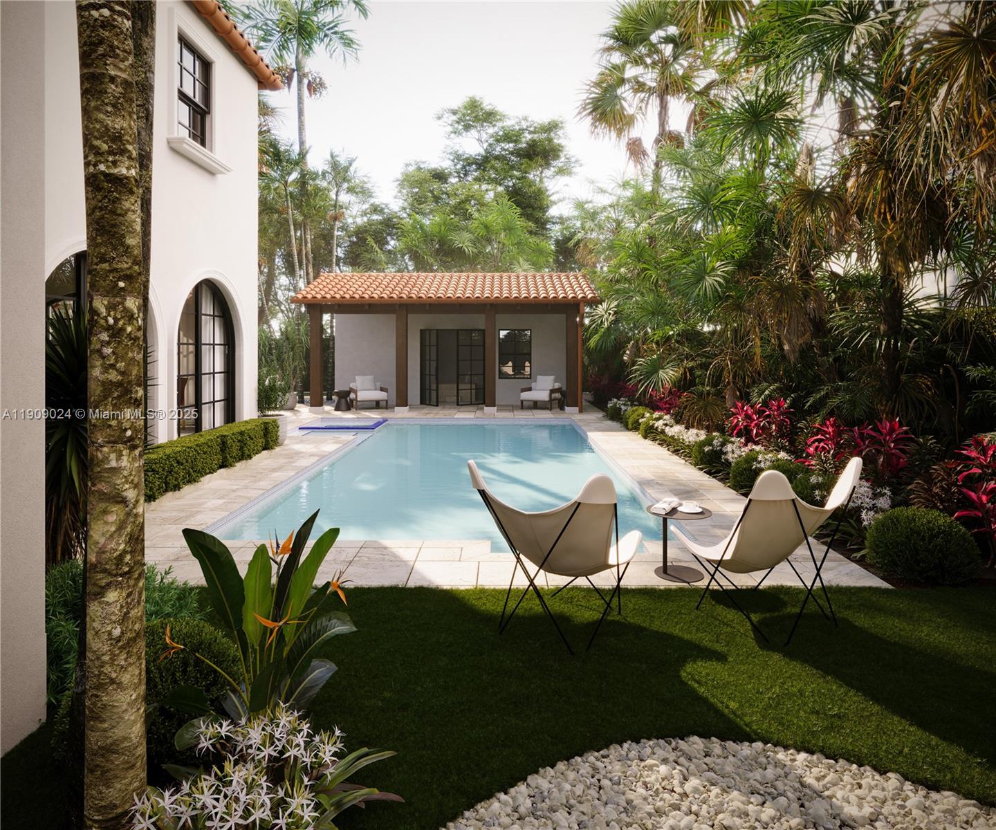 4727 North Bay Road Miami Beach, FL 33140 - Photo 2 of 15 a house view with a seating space and garden