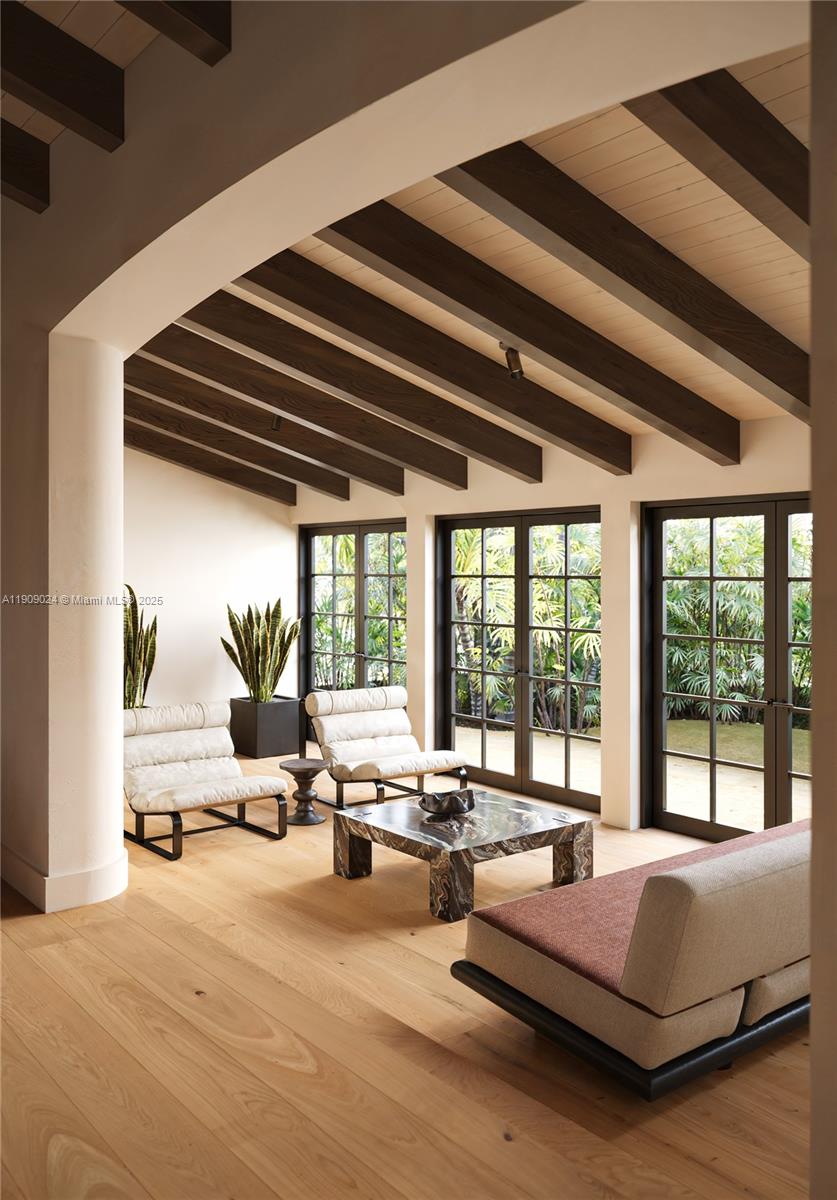 4727 North Bay Road Miami Beach, FL 33140 - Photo 4 of 15 a bedroom with furniture and large windows