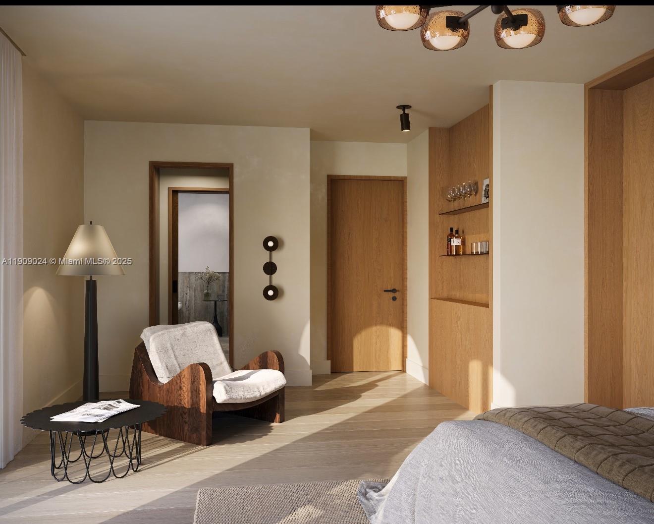 4727 North Bay Road Miami Beach, FL 33140 - Photo 7 of 15 a bedroom with a bed and a chandelier