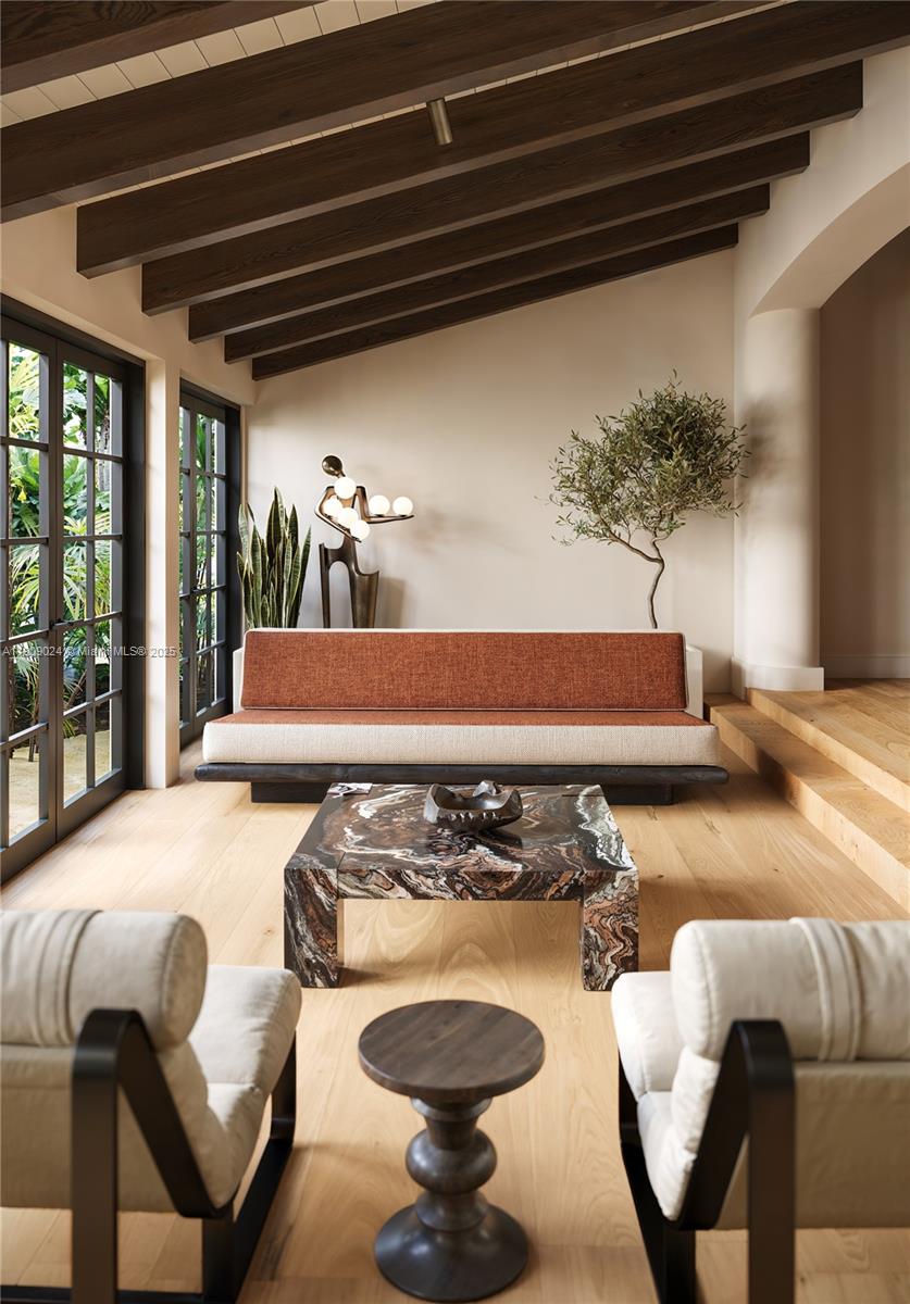 4727 North Bay Road Miami Beach, FL 33140 - Photo 10 of 15 a kitchen with a table chairs and a stove