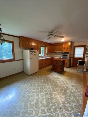 a kitchen with microwave and stove