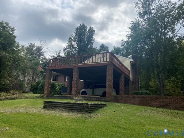 a view of a house with garden and a swimming pool
