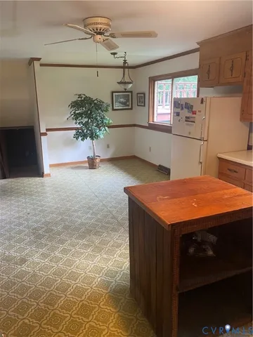 a kitchen with kitchen island a sink stainless steel appliances and cabinets