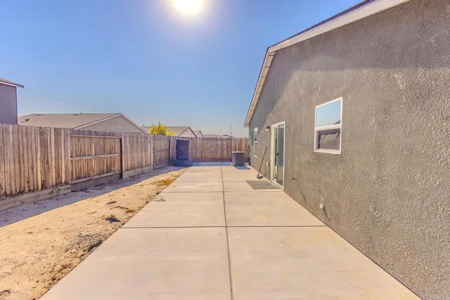 a view of a balcony with wooden floor and stairs