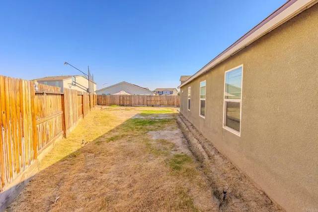 a view of a kitchen with a sink and a chandelier