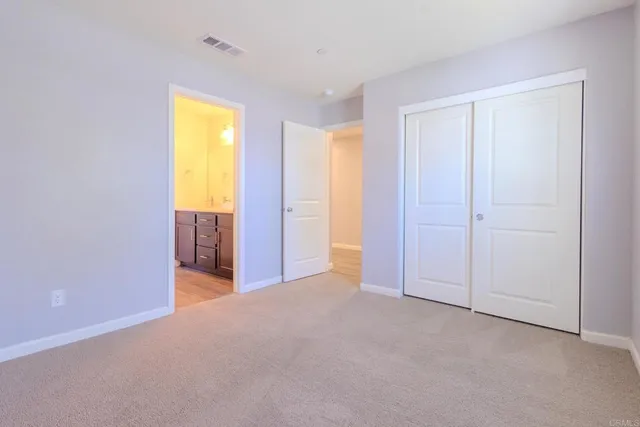 a view of an empty room and a window