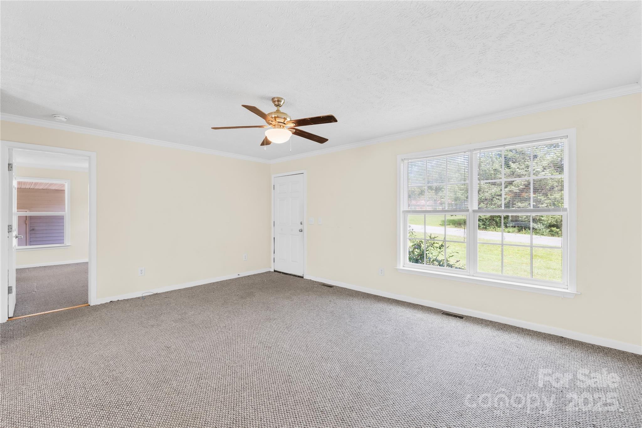 280 Harrill Dairy Road Forest City, NC 28043 - Photo 3 of 19 an empty room with windows and fan