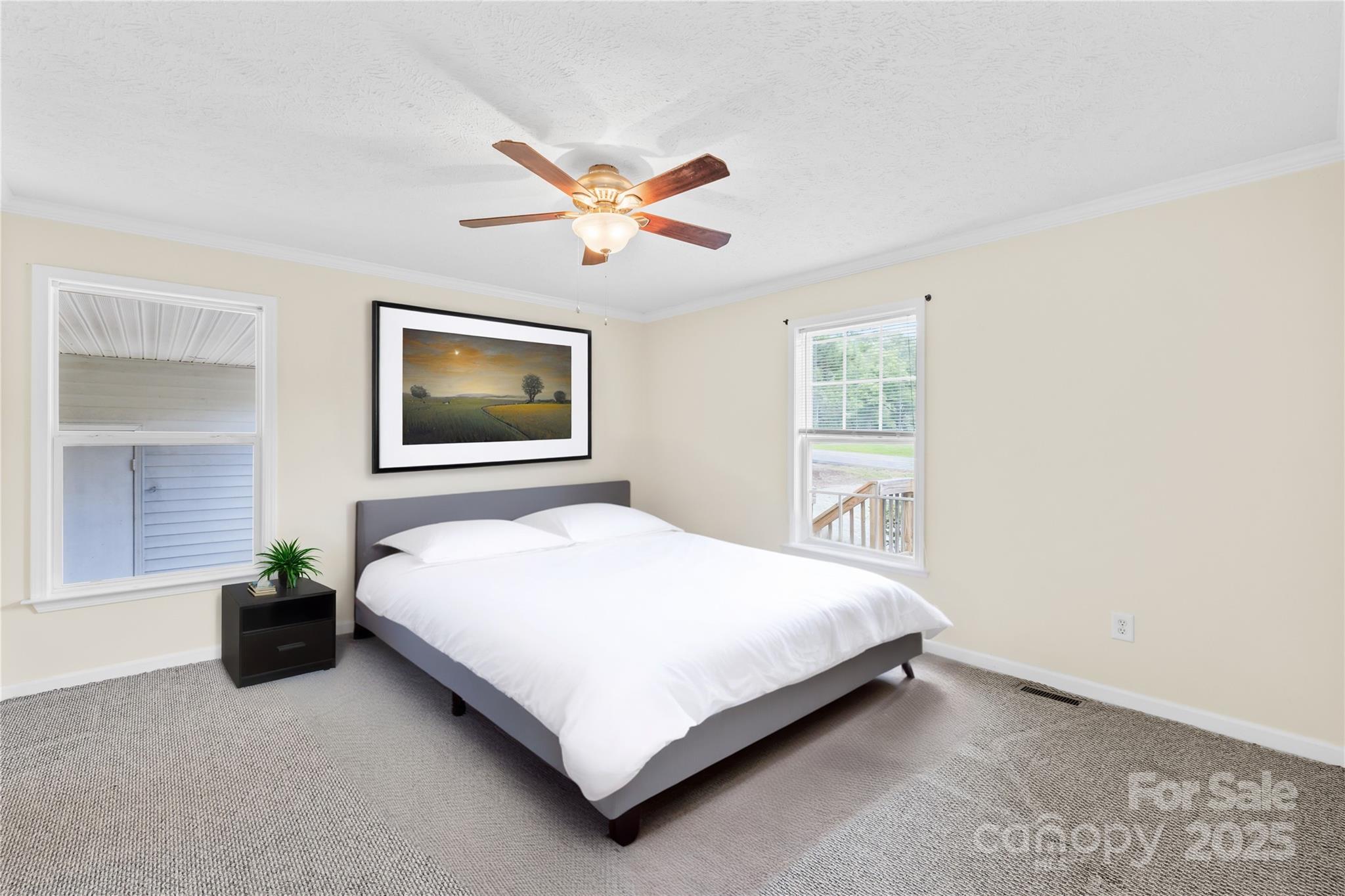 280 Harrill Dairy Road Forest City, NC 28043 - Photo 8 of 19 a bedroom with a bed lamp and a potted plant