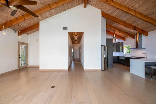 a kitchen with a refrigerator a sink and a stove