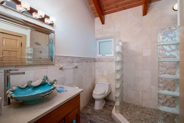 a aerial view of a house with swimming pool garden and patio